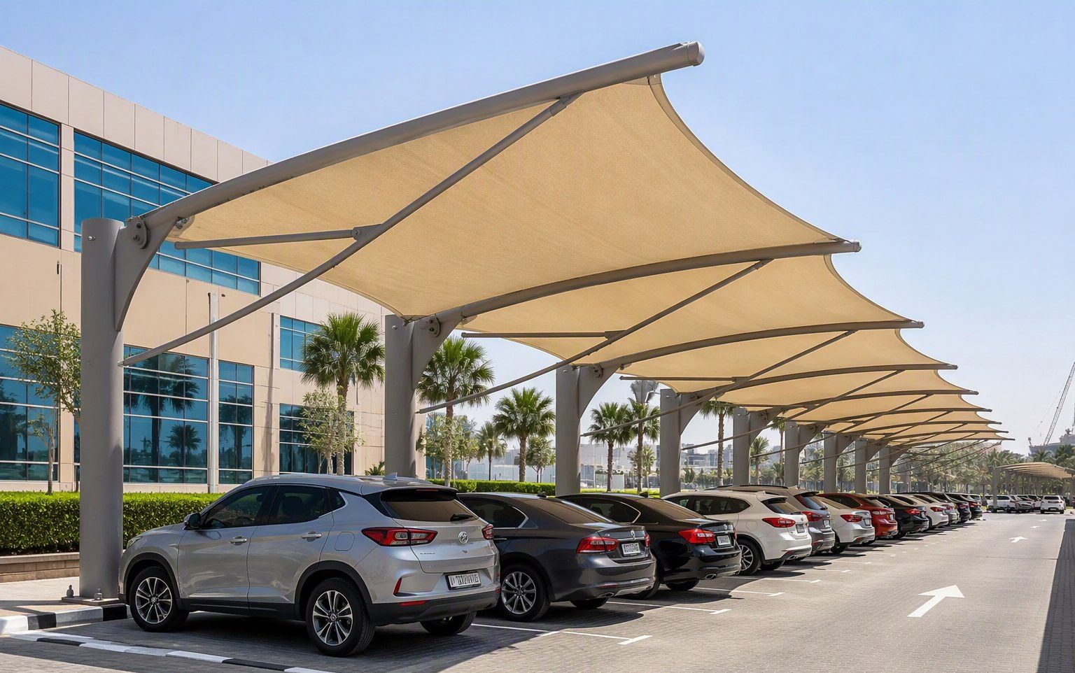 Cantilever car parking shade structure installed by Al Hamra Industries at a commercial building in the UAE