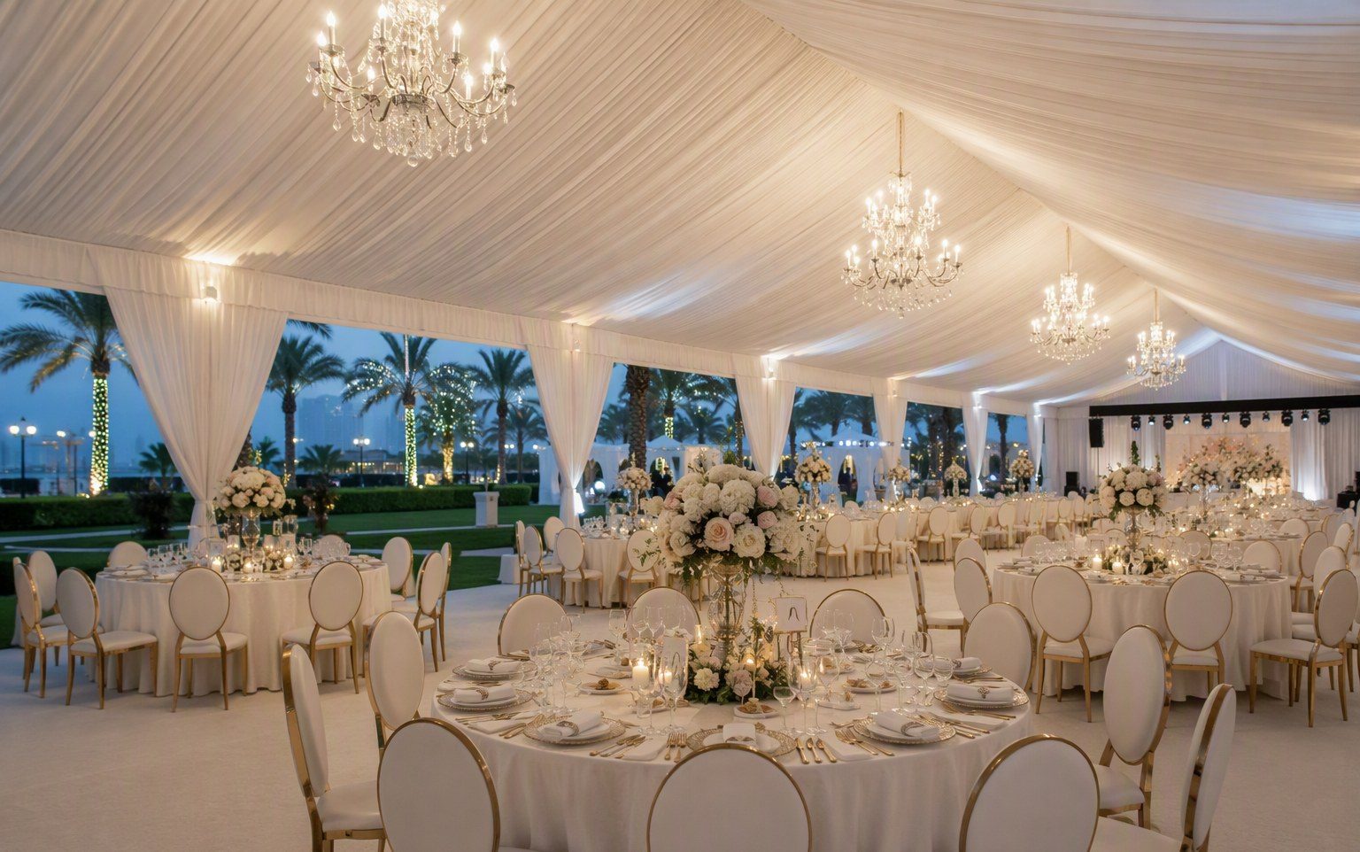 Elegant wedding marquee tent with draped interior at a UAE venue by Al Hamra Industries