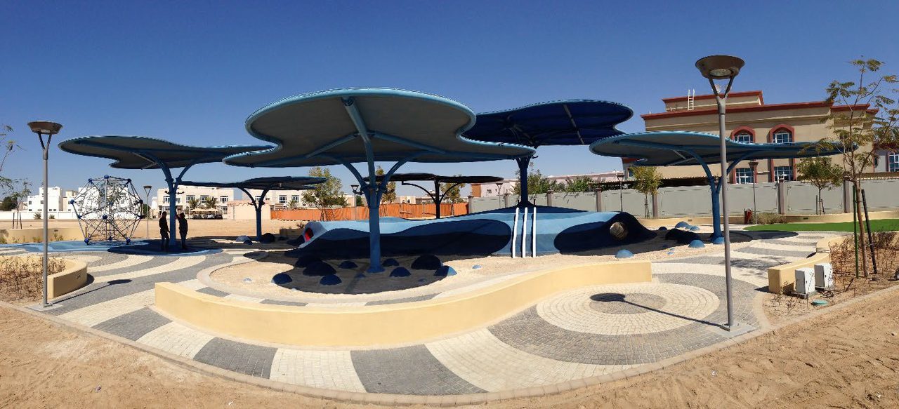 Mushroom-form shade structures in an Abu Dhabi Municipality playground